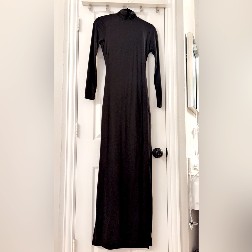 Beautiful brand new body hugging dress with open back and gold hardware.